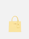 Borsa Shop mini strutturata in pelle liscia giallo tenue con targhetta metallica